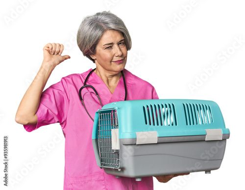 Caucasian mid-age vet holding pet carrier feels proud and self confident, example to follow.