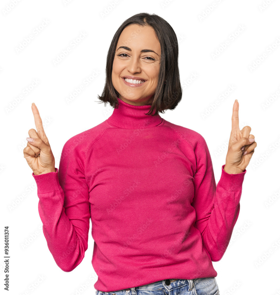 Young Caucasian woman with short hair indicates with both fore fingers up showing a blank space. Young Caucasian woman with short hair indicates with both fore fingers up showing a blank space.