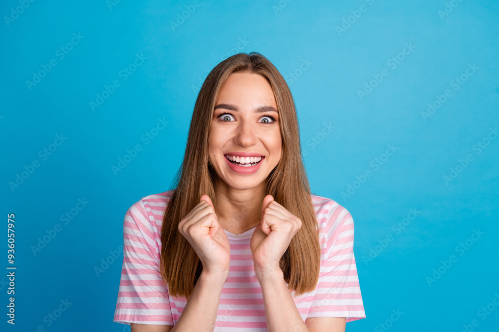Photo of good mood cute woman wear trendy pink clothes isolated on blue color background Photo of good mood cute woman wear trendy pink clothes isolated on blue color background
