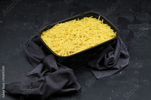 Handmade Turkish Noodles (Turkish Name: Eriste) in bowl. Erishte from Traditional Turkish Cuisine. Vermicelli on wooden background. photo