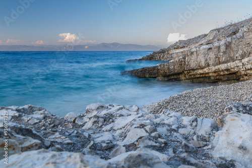 Landscape with sea, sky and rocks at sunset.