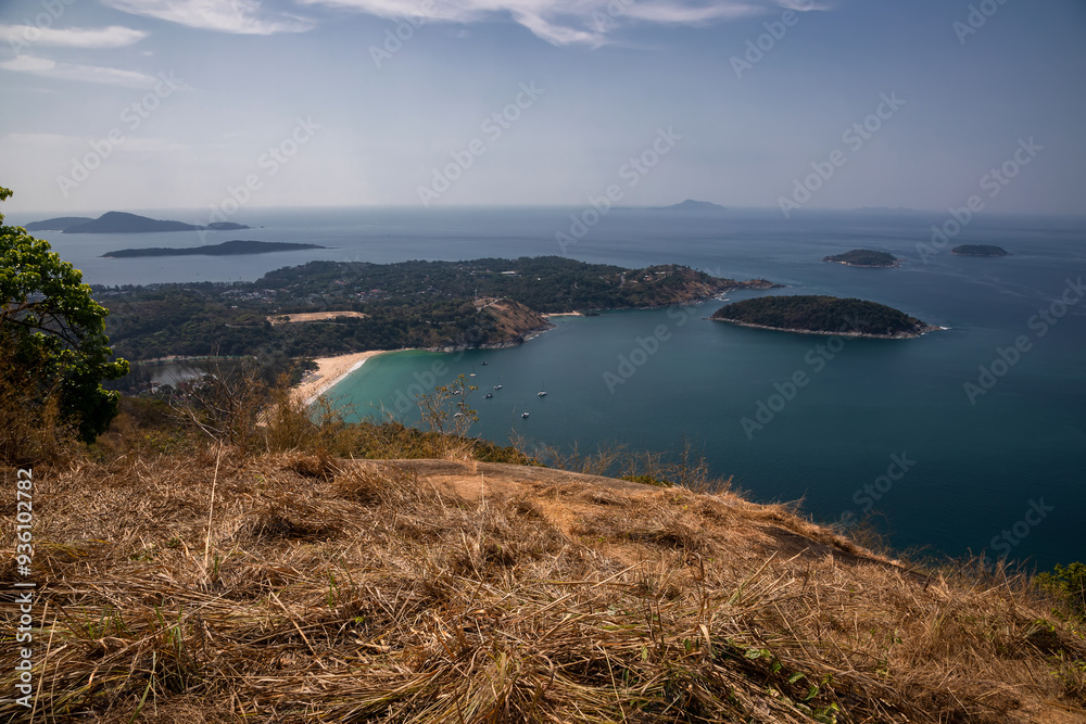 Beautiful beach with colorful water. Top view of the beautiful coastline. Sunny summer day. Colorful water. Sandy beach. Beautiful beach with colorful water. Top view of the beautiful coastline. Sunny summer day. Colorful water. Sandy beach.