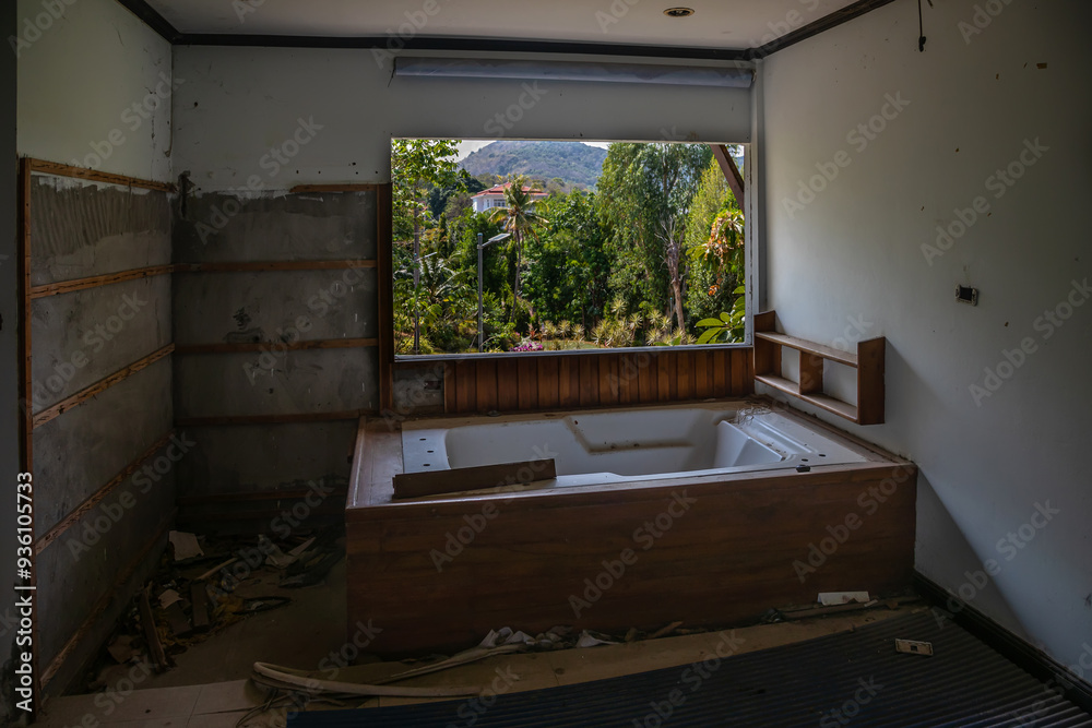 A dark room in an abandoned hotel. Shabby walls. An old abandoned hotel. Light and shadow. A dark room in an abandoned hotel. Shabby walls. An old abandoned hotel. Light and shadow.