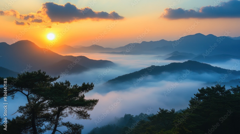 Obraz premium Sunrise Over Foggy Mountain Landscape