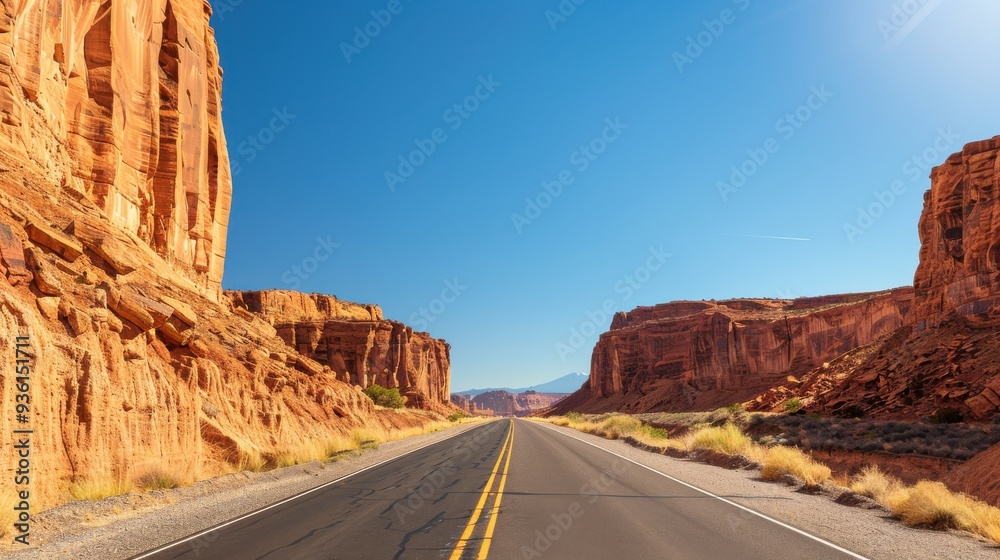 Straight Road Through Red Rock Canyon Under Clear Sky Straight Road Through Red Rock Canyon Under Clear Sky