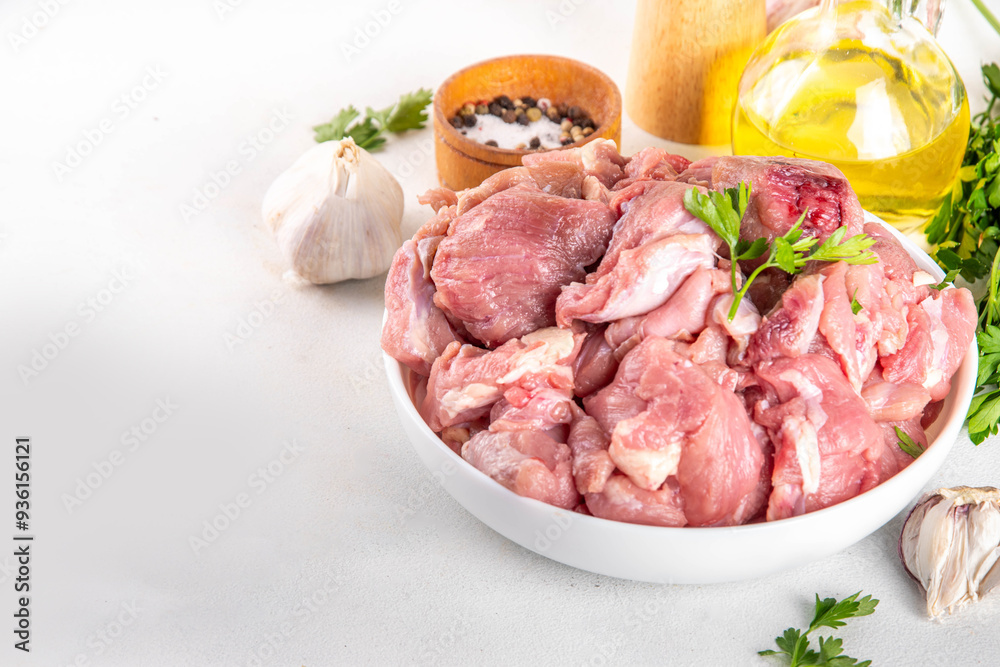 Veal, beef red meat raw chopped goulash, with herbs, condiment, olive oil and spices, cooking dinner background copy space Veal, beef red meat raw chopped goulash, with herbs, condiment, olive oil and spices, cooking dinner background copy space