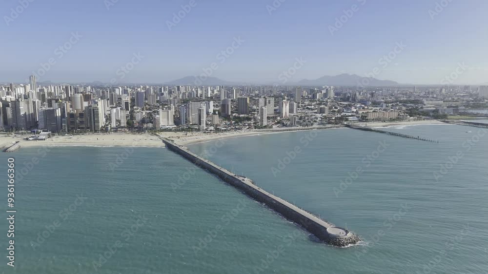 Drone orbits to left over ocean above João Cordeiro Pier at Praia de Iracema in Fortaleza, Ceara, Brazil Drone orbits to left over ocean above João Cordeiro Pier at Praia de Iracema in Fortaleza, Ceara, Brazil
