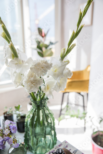 Beautiful bouquet of white carnations and gladiol photo