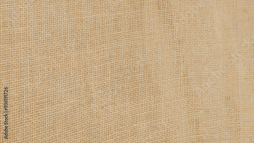 Brown linen fabric cloth texture for background, natural textile pattern.
