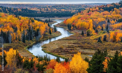 Colorful autumn scene, forest, winding river, vibrant foliage