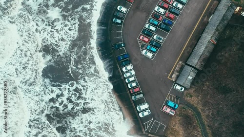 Stormy winter scene. Rough seas of the English coast with mist and fog. Aerial footage of the sleepy coastal town of Sandsend beach on the coast of north Yorkshire in England