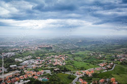 Breathtaking view of the San Marino landscape under a cloudy sky during late afternoon