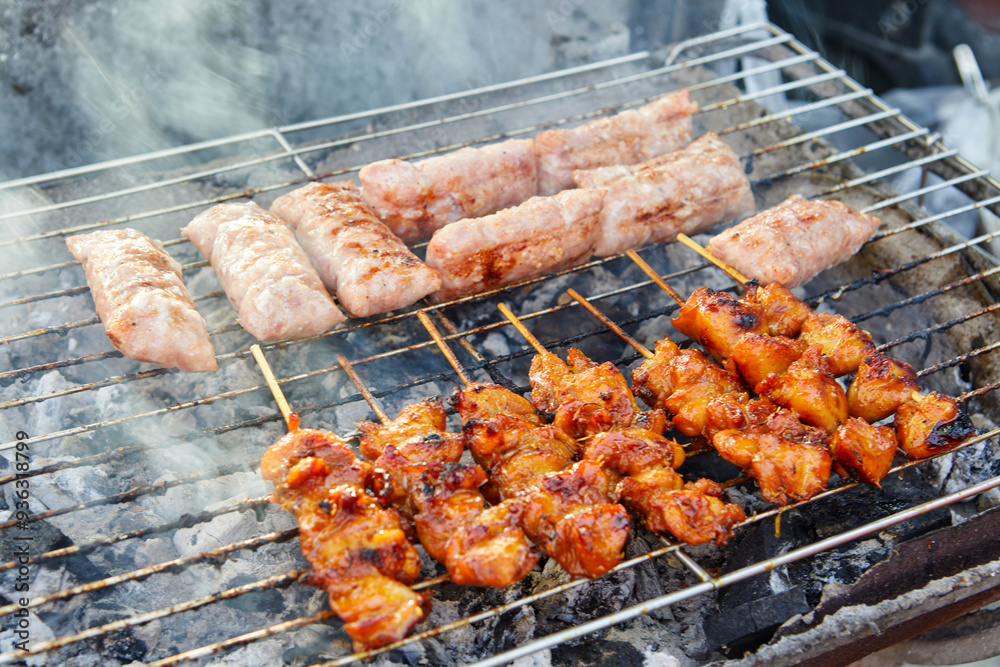 Grilled skewers chicken meat and fermented pork on barbecue grill Grilled skewers chicken meat and fermented pork on barbecue grill