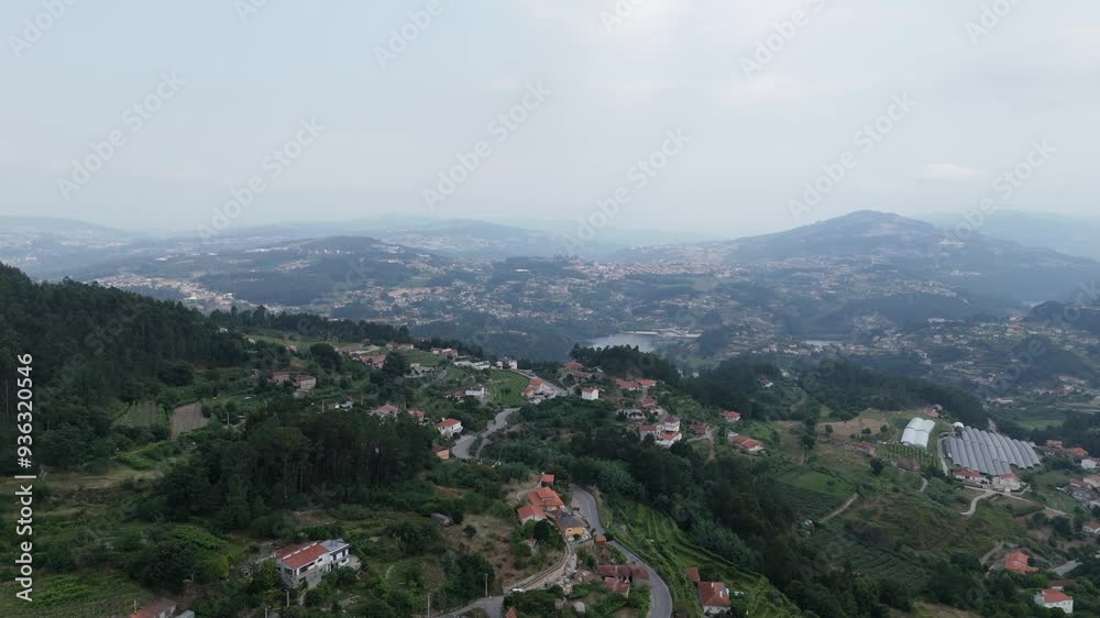 Aerial view of Castelo de Paiva's rolling hills and scattered homes. Portugal Aerial view of Castelo de Paiva's rolling hills and scattered homes. Portugal
