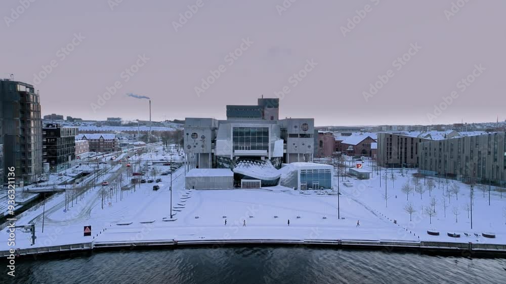 Winter aerial cityscape of Aalborg, North Jutland Region (Nordjylland), Denmark. Famous landmark - House of Music (Musikkens Hus) is in the center Winter aerial cityscape of Aalborg, North Jutland Region (Nordjylland), Denmark. Famous landmark - House of Music (Musikkens Hus) is in the center