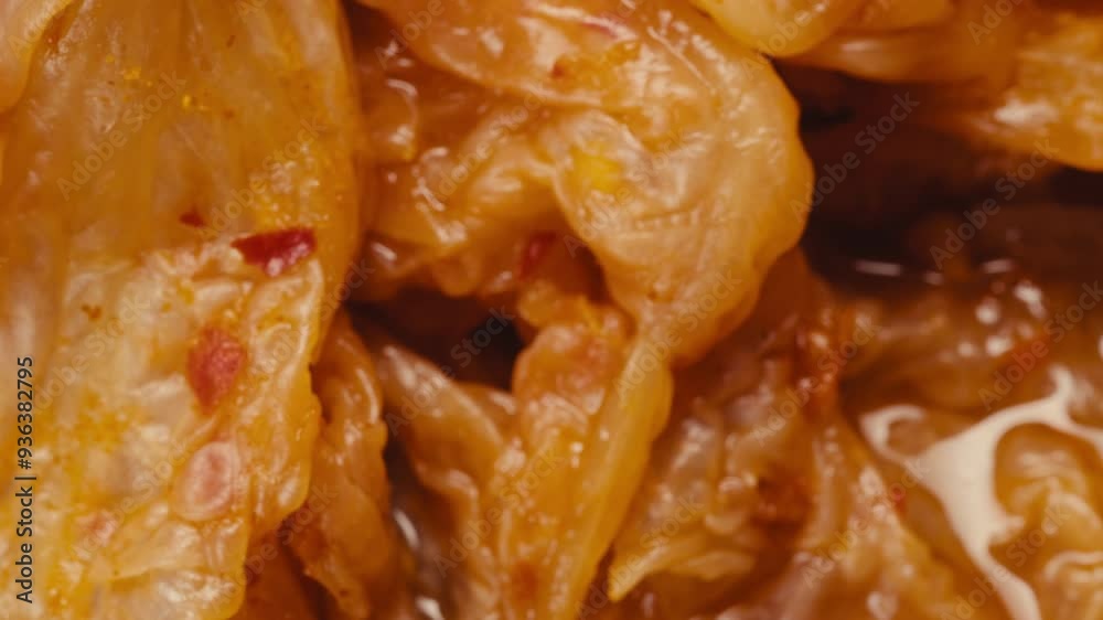 Close-up of texture fermented spicy cabbage kimchi with in can. Preservation of vegetables in glass jars. Fermentation preserved kimchi cabbage with spices macro. Asian cuisine. Close-up of texture fermented spicy cabbage kimchi with in can. Preservation of vegetables in glass jars. Fermentation preserved kimchi cabbage with spices macro. Asian cuisine.