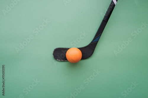 isolated image of a hockey stick and ball photo