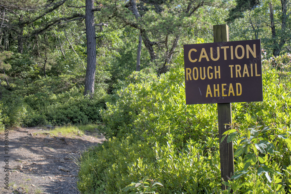 caution rough trail ahead sign on gravel cycling walking hiking trail path in minnewaska state park carriage road system (biking riding cycle bike bicycle) nature public landscape caution rough trail ahead sign on gravel cycling walking hiking trail path in minnewaska state park carriage road system (biking riding cycle bike bicycle) nature public landscape