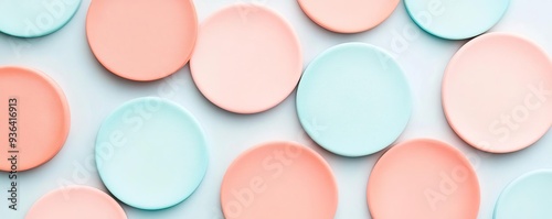 Faded pastel circles with light coral and sky blue, soft color palette, playful abstract