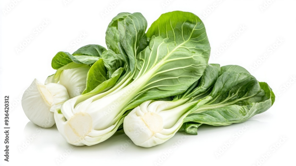 Freshly Chopped Bok Choy Isolated on a White Background, Highlighting the Vibrant Green of Chinese Cabbage in a Healthy and Appetizing Presentation. Freshly Chopped Bok Choy Isolated on a White Background, Highlighting the Vibrant Green of Chinese Cabbage in a Healthy and Appetizing Presentation.