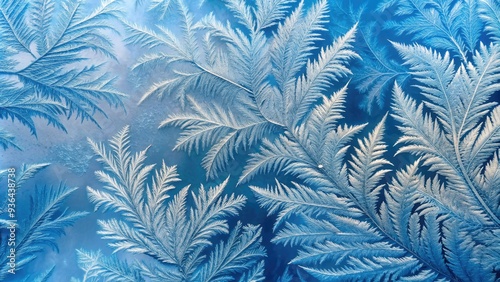 Delicate frost patterns dance across a soft, serene, and icy blue winter background, evoking a sense of calm and tranquility in the stillness of the season.