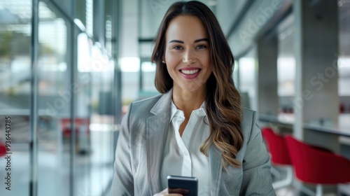 The confident businesswoman with phone