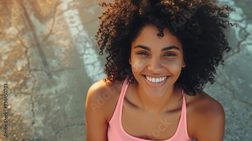 The smiling woman outdoors