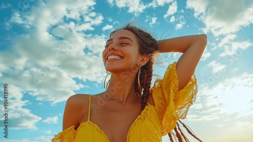 Young woman with braided hair smiles under a bright blue sky on a sunny day