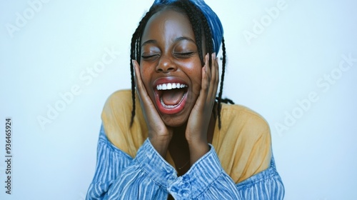 Woman expressing joy and relaxation indoors during a social gathering