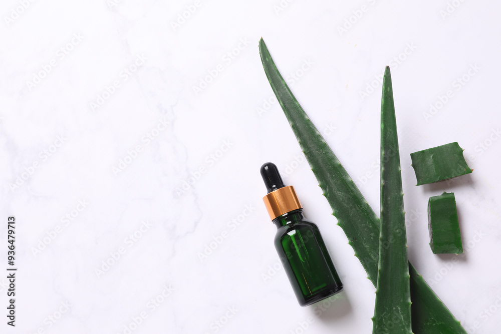 Skin care with cosmetic facial aloe serum. Glass bottle with a pipette on a white background. Dry skin care product. Essential oil for moisturizing the skin of the body. Skin care with cosmetic facial aloe serum. Glass bottle with a pipette on a white background. Dry skin care product. Essential oil for moisturizing the skin of the body.