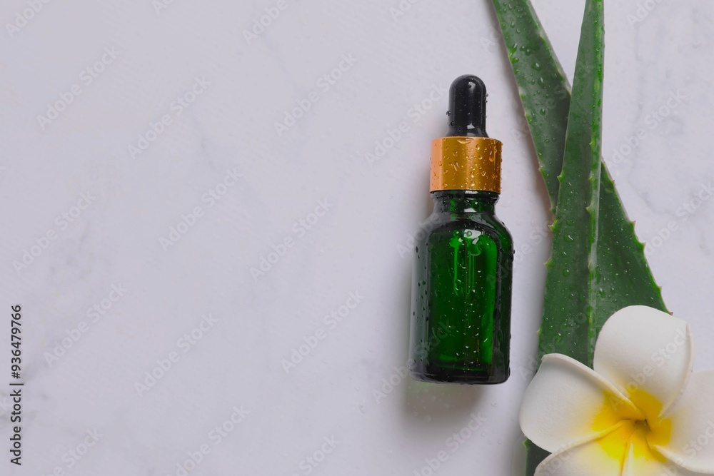 Skin care with cosmetic facial aloe serum. Glass bottle with a pipette on a white background. Dry skin care product. Essential oil for moisturizing the skin of the body. Skin care with cosmetic facial aloe serum. Glass bottle with a pipette on a white background. Dry skin care product. Essential oil for moisturizing the skin of the body.
