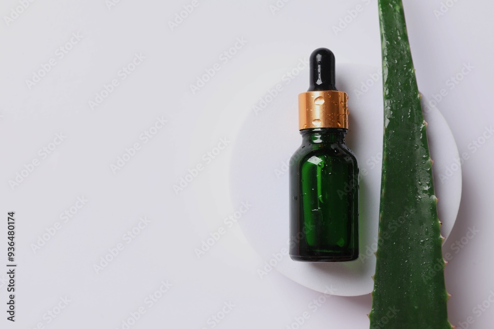 Skin care with cosmetic facial aloe serum. Glass bottle with a pipette on a white background. Dry skin care product. Essential oil for moisturizing the skin of the body. Skin care with cosmetic facial aloe serum. Glass bottle with a pipette on a white background. Dry skin care product. Essential oil for moisturizing the skin of the body.