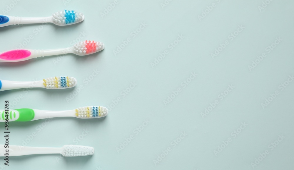 Various toothbrushes on a colored background. Concept of tooth treatment and dental care