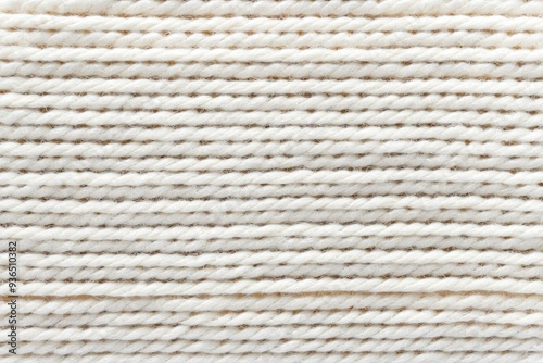 A close-up of a soft and cozy white knitted blanket with intricate stitches