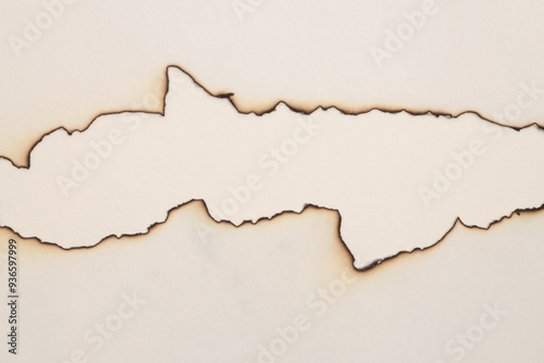 Burned  Torn, ripped paper pieces wave lines frame. Beige, brown copy space texture background