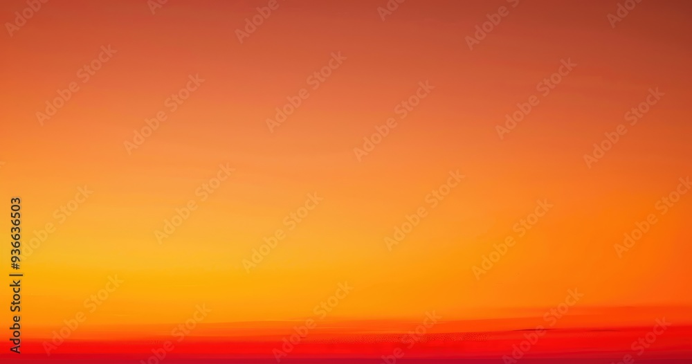 Naklejka premium A serene sunset blending warm hues of orange and yellow, creating a calming atmosphere.
