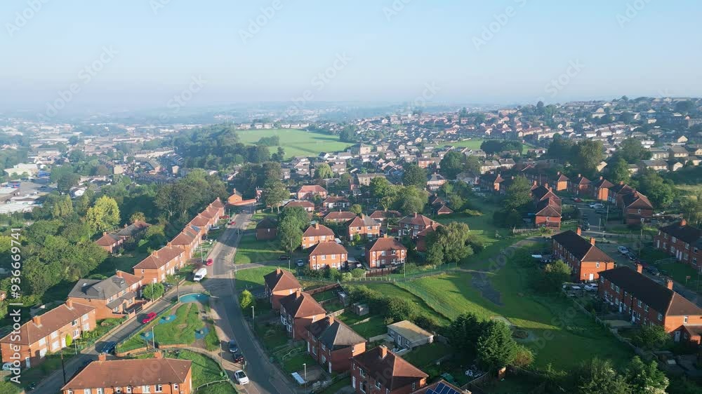 Aerial video provides an overview of Dewsbury Moore Council estate in the UK, highlighting red-brick housing and the industrial Yorkshire