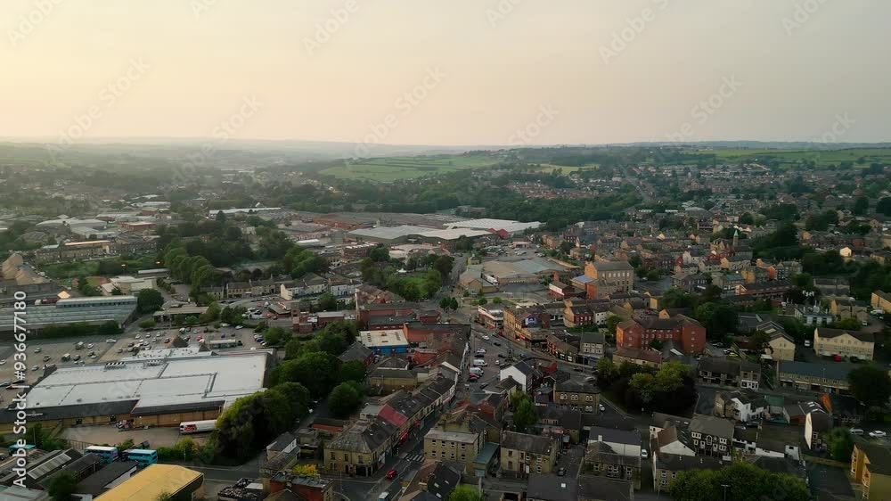 Heckmondwike, UK, captured by a drone, featuring industrial buildings, vibrant streets, the old town center, and the scenic Yorkshire view on a summer evening. Heckmondwike, UK, captured by a drone, featuring industrial buildings, vibrant streets, the old town center, and the scenic Yorkshire view on a summer evening.