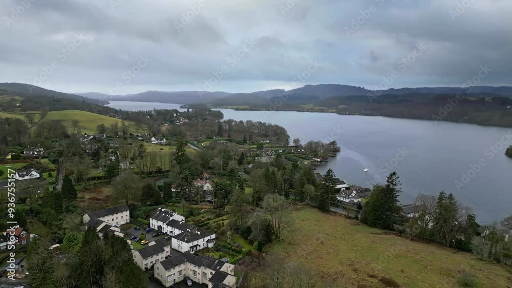 Cinematic, aerial drone clip of the quiet town village of Bowness-on-Windermere in the Cumbrian Lake. Cinematic, aerial drone clip of the quiet town village of Bowness-on-Windermere in the Cumbrian Lake.
