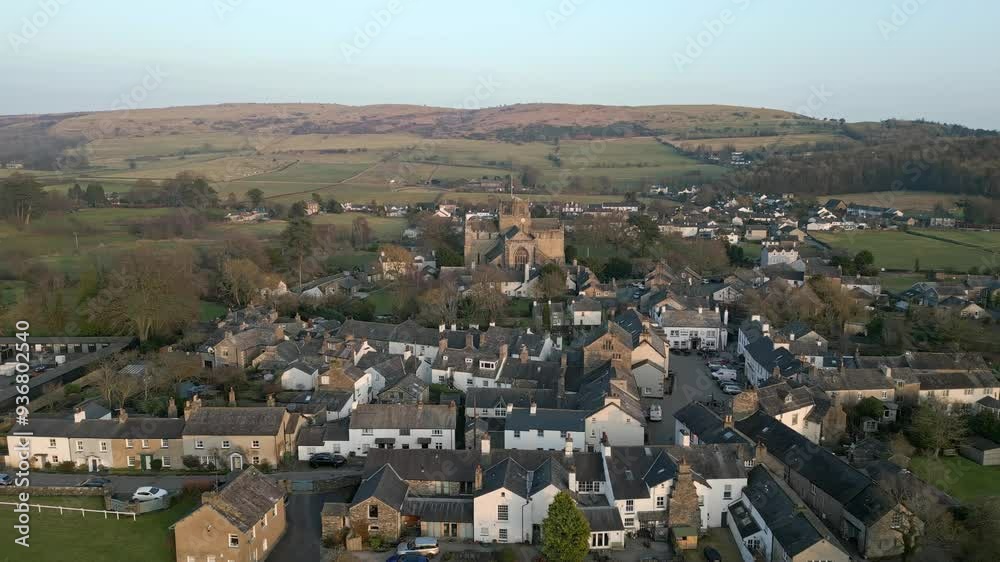 Slow Motion clip of the Cumbrian medieval village of Cartmel showing the historic Cartmel Priory at sunset Slow Motion clip of the Cumbrian medieval village of Cartmel showing the historic Cartmel Priory at sunset