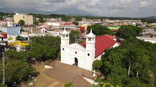 Iglesia colonial en medio de un pueblo photo