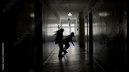 Wallpaper Mural Silhouettes of male and female partners performing contemporary dance improvisation in dark hallway Torontodigital.ca