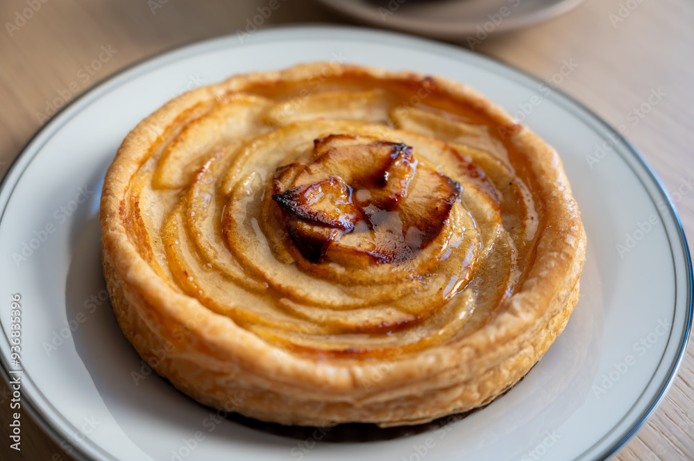 French fresh baked sweet puff pastry with fresh apple fruits in sirup in confectionery shop French fresh baked sweet puff pastry with fresh apple fruits in sirup in confectionery shop