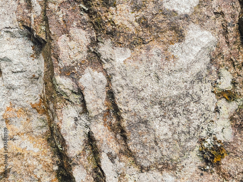 close up vief of detailed rock stone with some white mold stain, grunge textured pattern image. photo