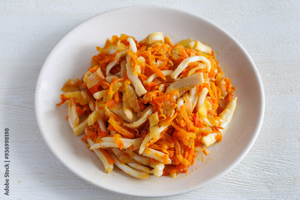 Korean food Stir-fried Squid, Squid stir-fried with onions, carrots in a spicy sauce Korean food Stir-fried Squid, Squid stir-fried with onions, carrots in a spicy sauce