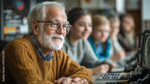 Senior Man Learning Computer Skills with Young People in Classroom