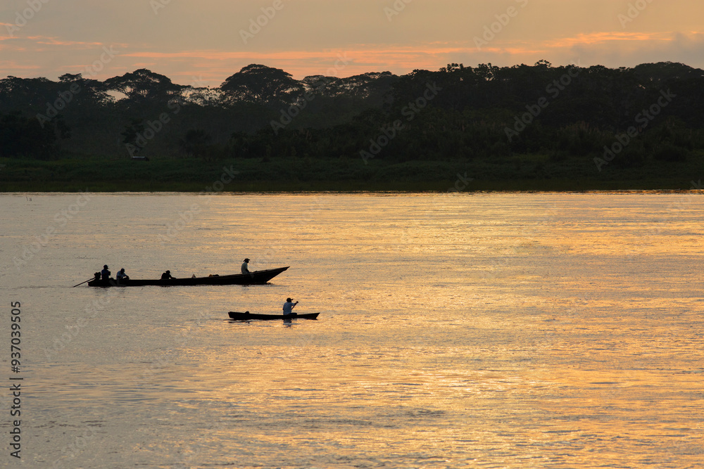 Canoe on Amazon River at Sunset Canoe on Amazon River at Sunset
