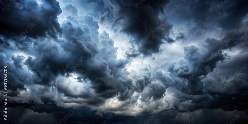 Dark and moody clouds covering the sky in a dramatic cloudscape background, stormy, overcast, weather, atmospheric, dramatic Dark and moody clouds covering the sky in a dramatic cloudscape background, stormy, overcast, weather, atmospheric, dramatic