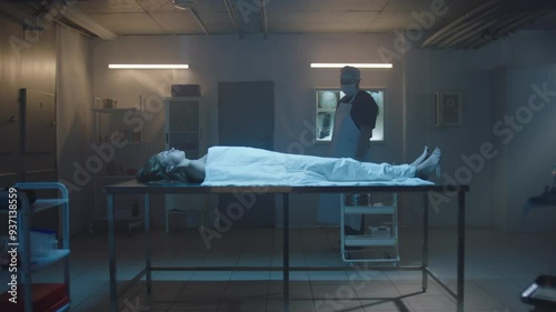 Pathologist and woman's cadaver on the table