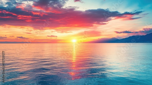 Beautiful sunset with vibrant colors over a calm sea, with space for text.